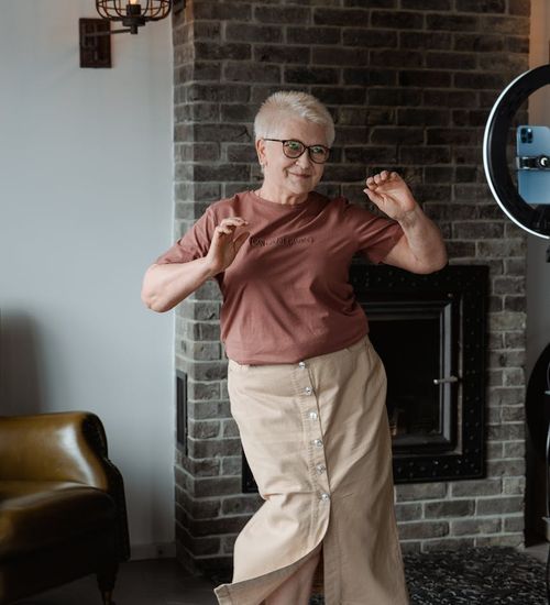 Woman feeling energetic and happy during a light workout at home.
